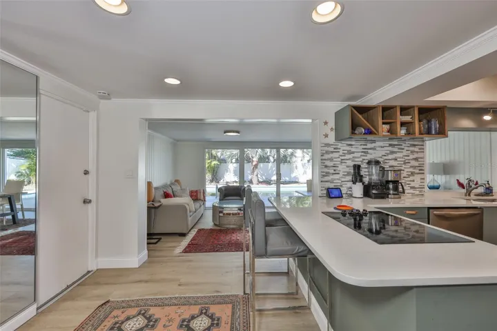 Kitchen area with breakfast bar and view of Sitting and Dining area