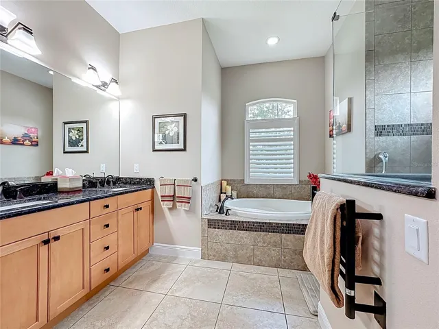 Primary Ensuite w/Soaking Tub and Heated Towel Bars.