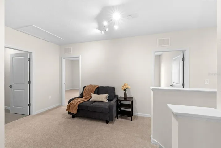 At the top of the stairs is the loft which can accommodate a couch, a desk, or even a large LoveSac beanbag!