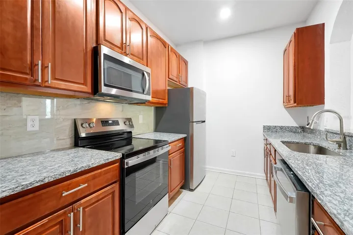 #12: Kitchen with All New Steel Appliances, New Granite Countertops, and Ceramic Back Splash!