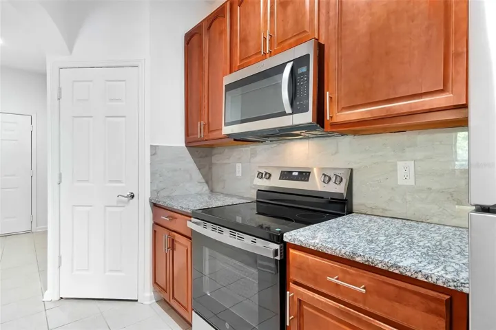 #14: Kitchen with All New Steel Appliances, New Granite Countertops, and Ceramic Back Splash!