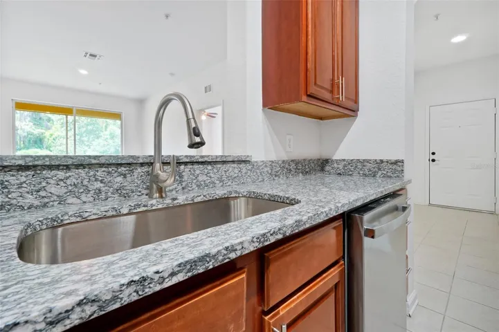 16.Montes-6265 Contessa Dr Unit 303-Kitchen Towards Sink