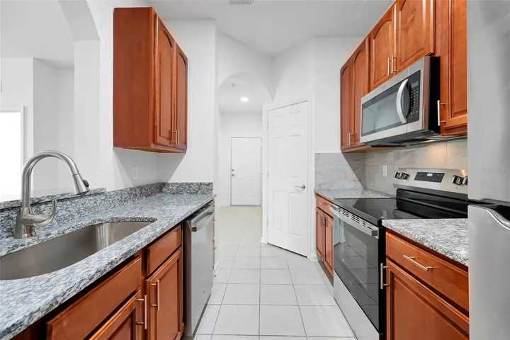 #13: Kitchen with All New Steel Appliances, New Granite Countertops, and Ceramic Back Splash!