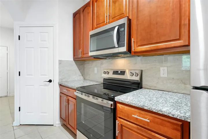 15.Montes-6265 Contessa Dr Unit 303-Kitchen Towards Stove