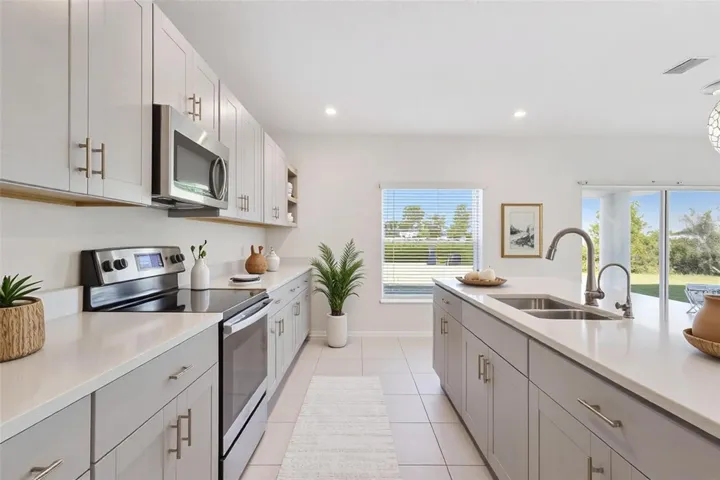 Designer Cloud grey cabinets and quart countertops