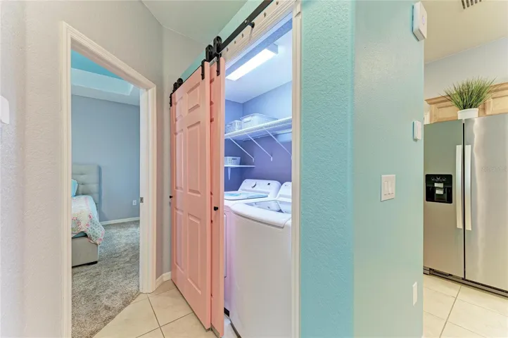 Laundry leading into the primary en suite
