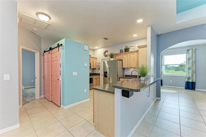 Kitchen and laundry closet outside of the primary en suite