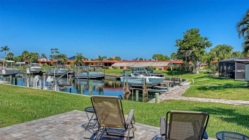 Large paver patio overlooking the canal