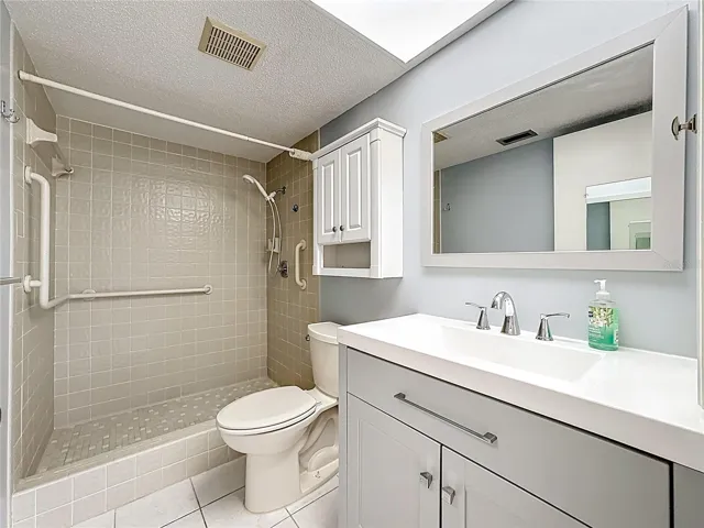 New vanity in primary bath and walk-in shower