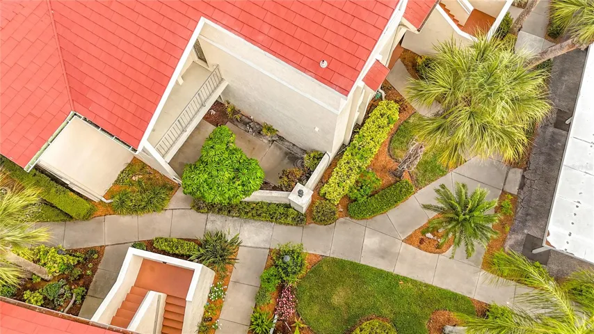 Common area walled patio is adjacent to this unit, creating the feel of your own private seating area.