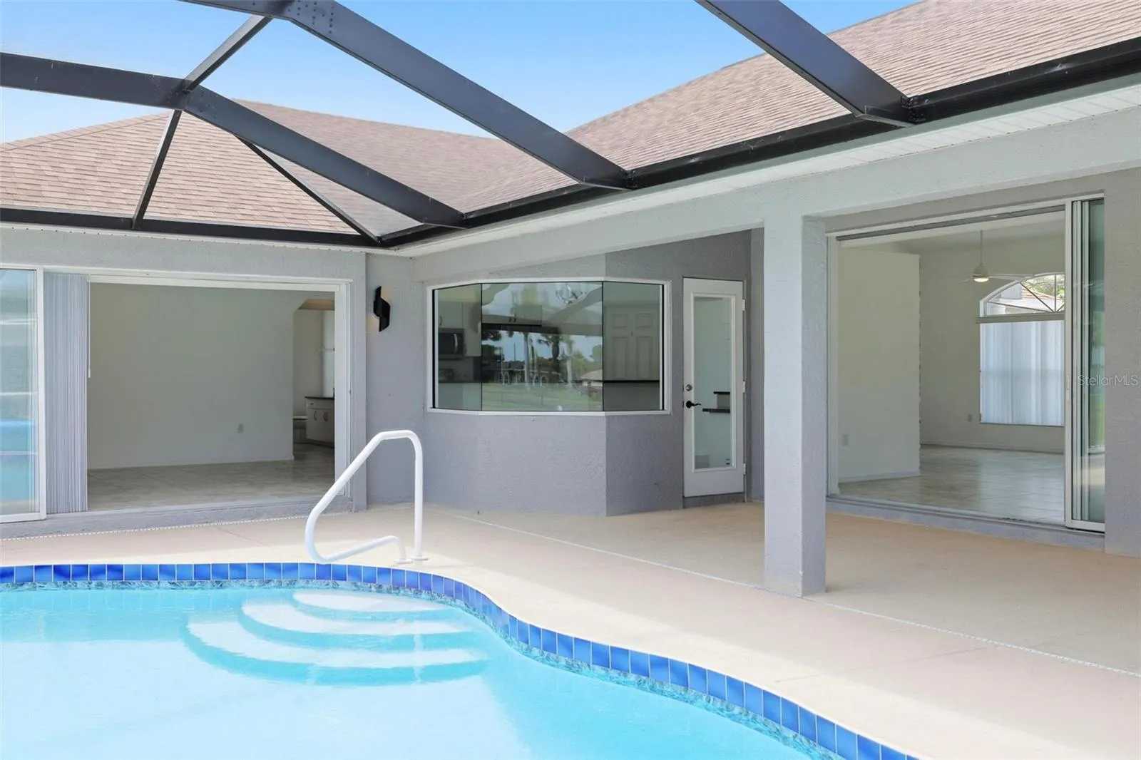 Serene heated pool area with 2024 pool heater and beautiful natural light