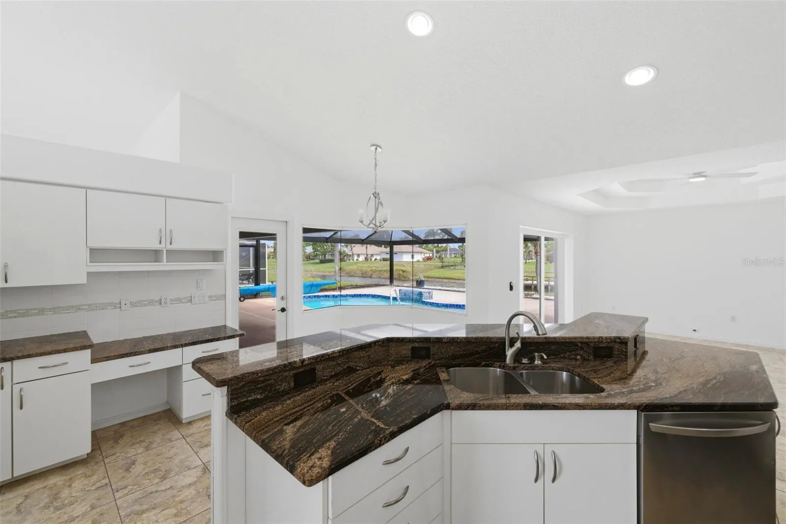 Open kitchen with large island, new 2024 stainless appliances, and ample counter space