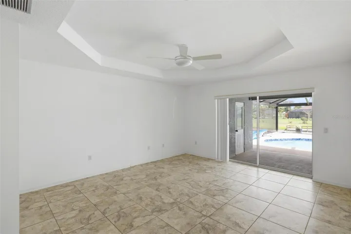 Airy bedroom with sliding glass door access and open, welcoming feel