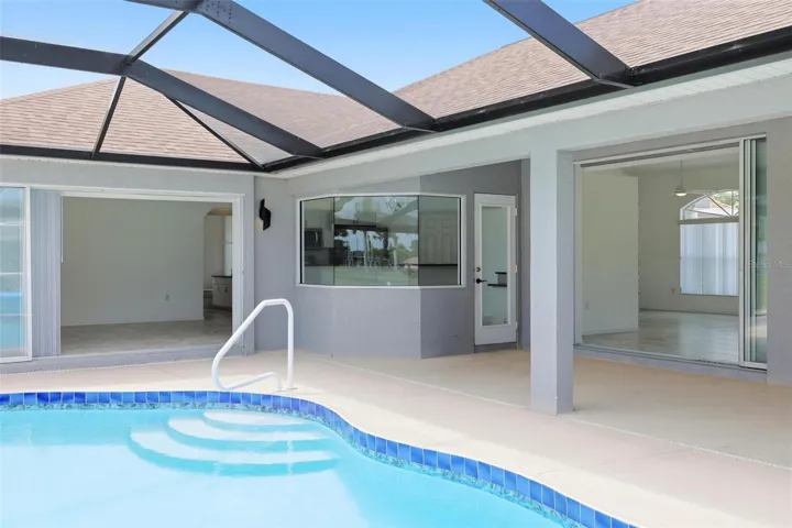 Serene heated pool area with 2024 pool heater and beautiful natural light