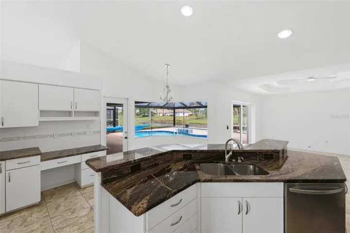 Open kitchen with large island, new 2024 stainless appliances, and ample counter space