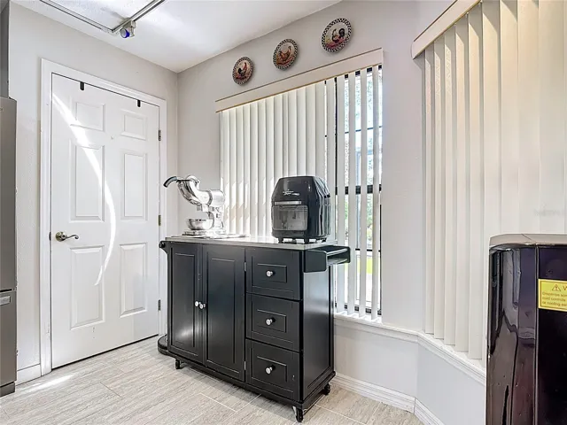 Kitchen Pantry with nice windows overlooking backyard