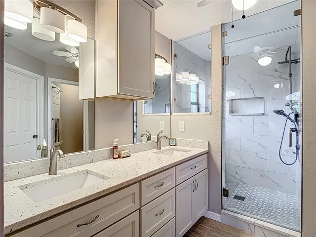 Primary bathroom Dual sinks. Spacious walk in shower