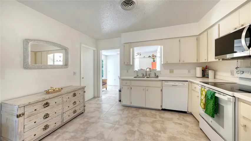 Kitchen with entrance ti dining area
