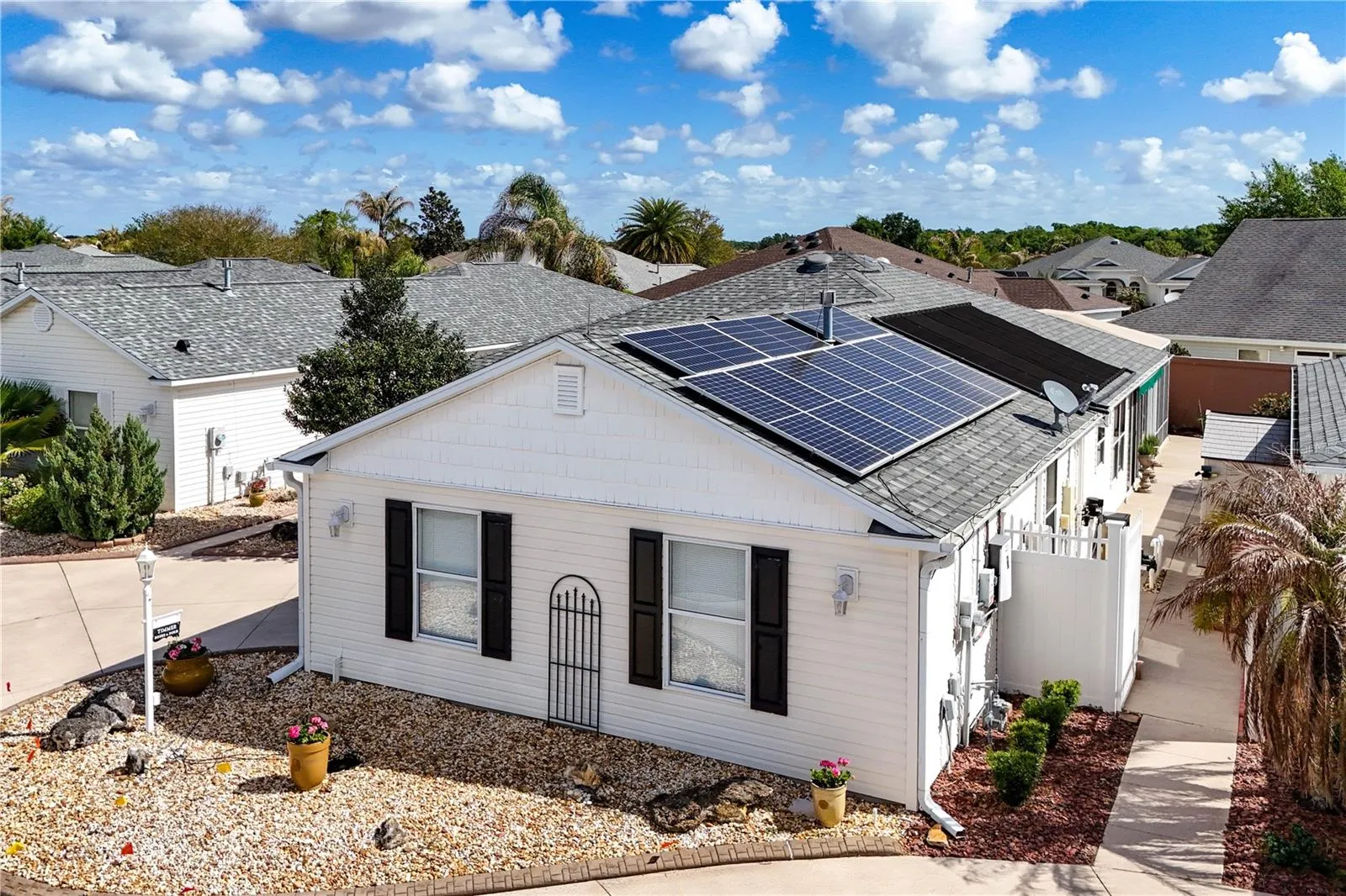 Solar Panels Complete with Generac Power Cell in Garage. This system provides a comprehensive energy solution, ensuring both solar power generation and backup power capabilities.