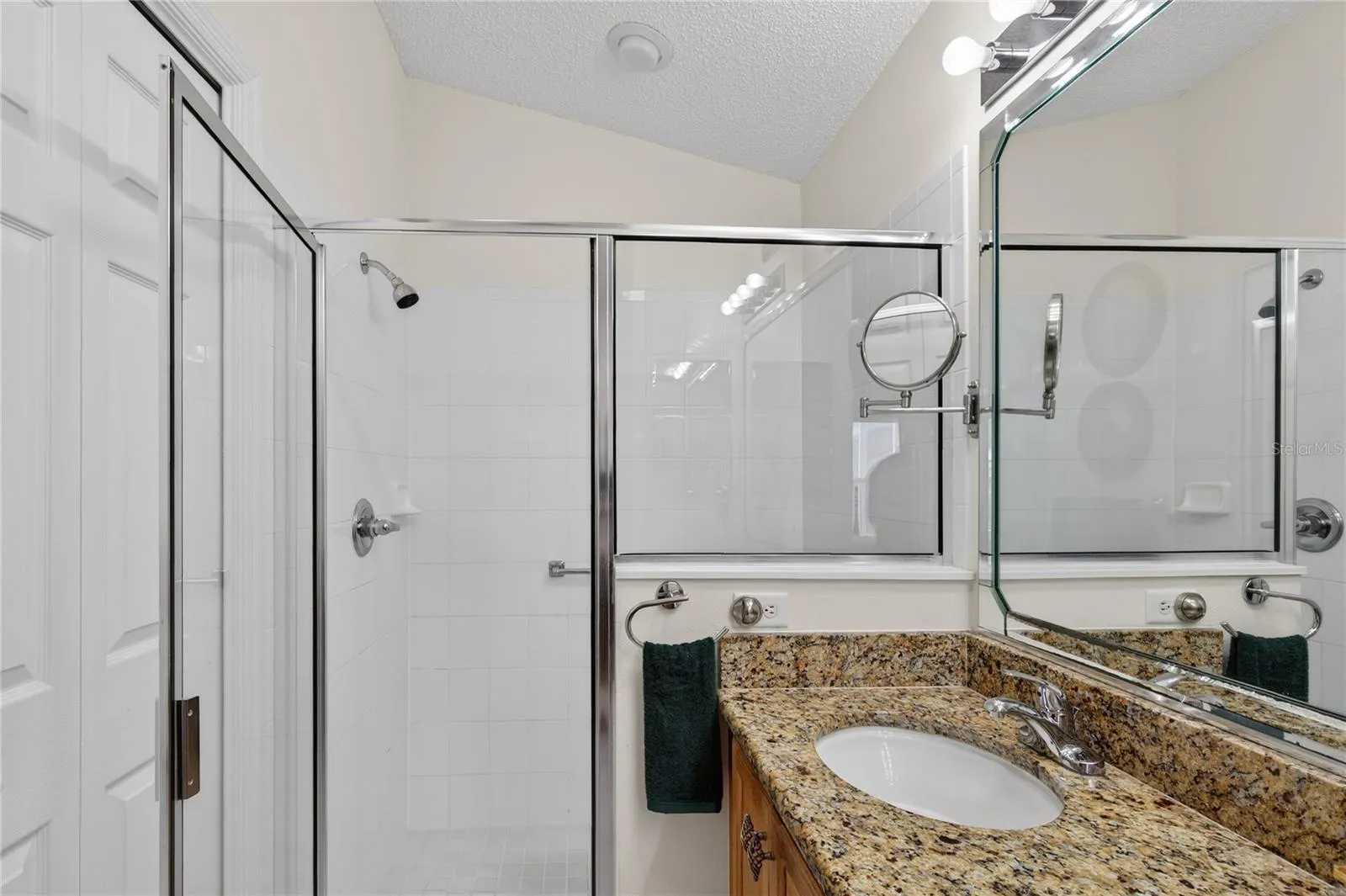 WALK-IN GLASS SHOWER AND LARGE CUSTOM WALK-IN CLOSET