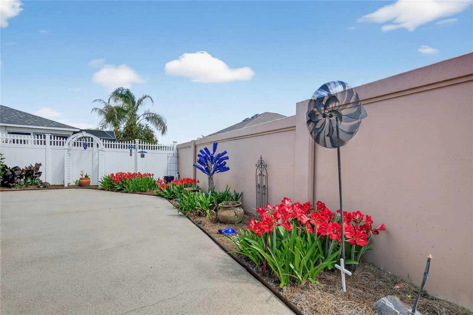SOLID PAINTED WALL AND VINYL FENCE INSURES PRIVACY FOR YOU, GUESTS AND PETS.  Enhances the comfort and enjoyment of residents, visitors, and animals.