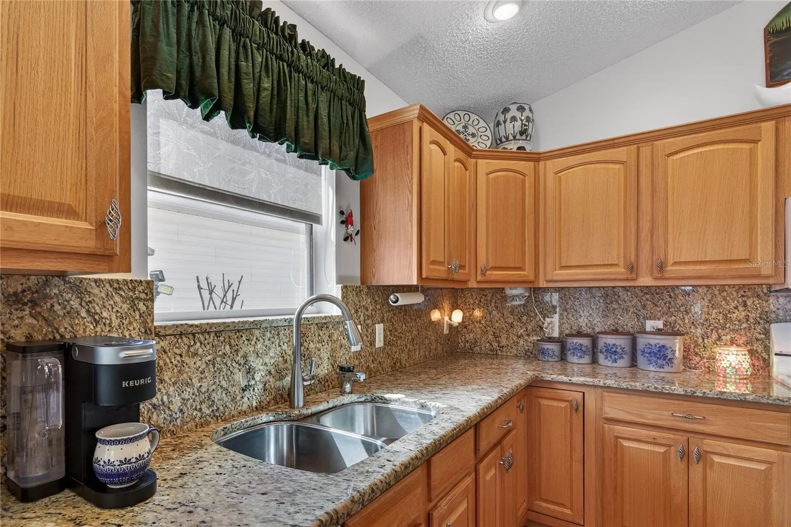 KITCHEN FEATURES STAINLESS STEEL DOUBLE SINK AND NEW PULL DOWN FAUCET