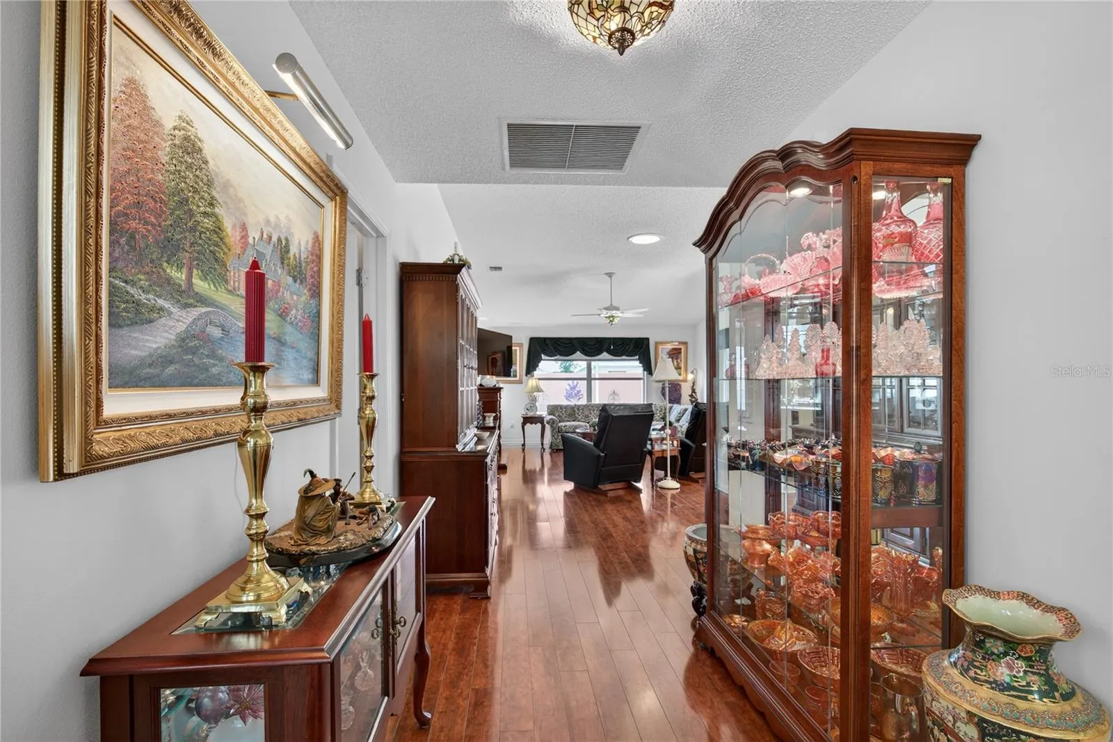 NOTICE THE GLEAMING LAMINATE WOOD FLOORS THROUGH OUT THE HOME.  NO CARPET
