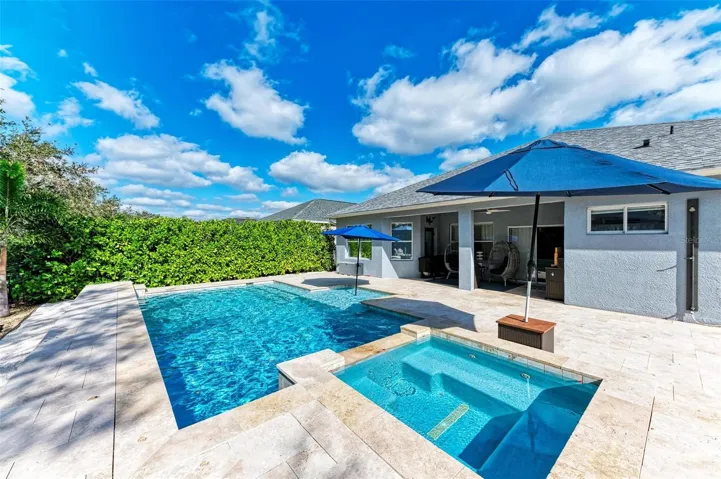 Heated, saltwater pool with spa and sunshelf.