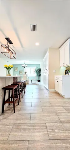 Kitchen Island Includes Tile & Wood Mosaic on Lower Wall
