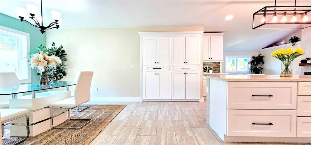 View of Dining, Luandry/Pantry Room & Kitchen