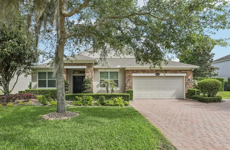 Perfectly situated inside the gated community of Magnolia Park Estates in Apopka, this beautifully upgraded home delivers a rare combination of thoughtful design, high-end finishes, and over $325K in improvements – set on a .26 ACRE LOT with no rear neighbors and peaceful views!