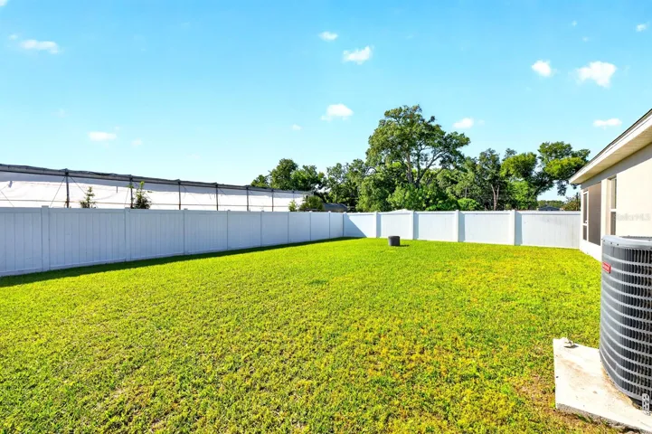Step outside to enjoy the GENEROUS BACKYARD, where the absence of rear neighbors creates a PEACEFUL RETREAT—ideal for morning coffee or evening relaxation.