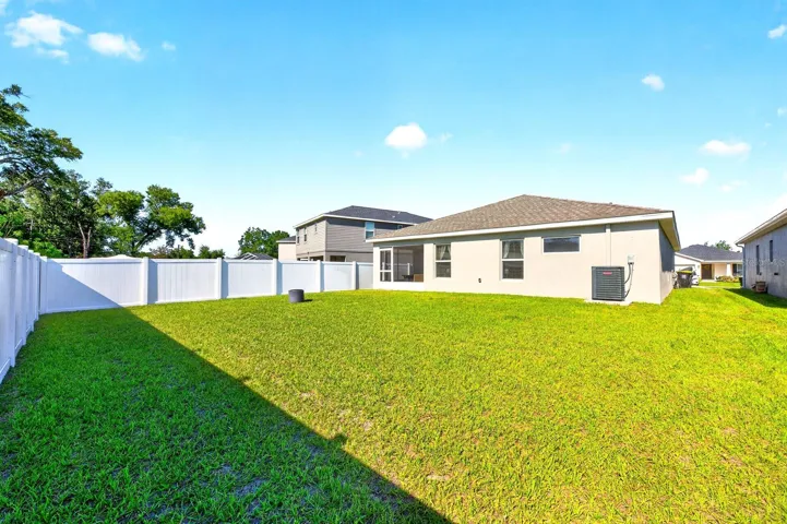 Step outside to enjoy the GENEROUS BACKYARD, where the absence of rear neighbors creates a PEACEFUL RETREAT—ideal for morning coffee or evening relaxation.