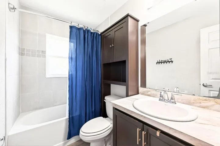 Three additional bedrooms and a SECOND FULL BATH offer flexibility for family or guests.