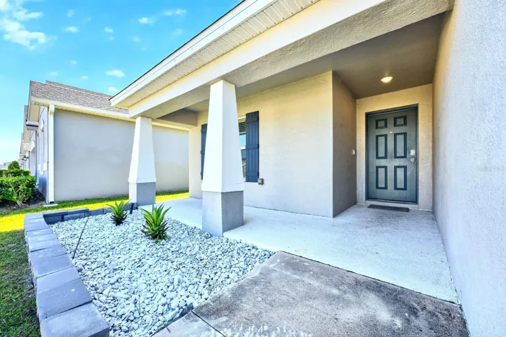 A welcoming front porch sets the tone as you step inside.