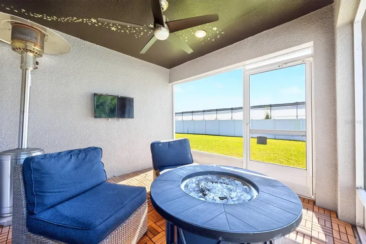 Sliding glass doors lead to the covered, screened patio extending your living space outdoors.