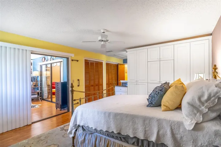 Primary Bedroom Looks Into Delightful Florida Room