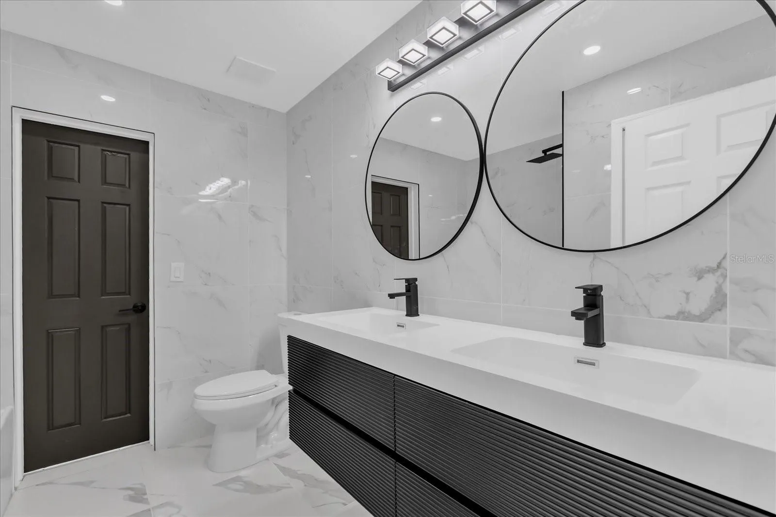 Secondary bath accesible from family room and pool area.