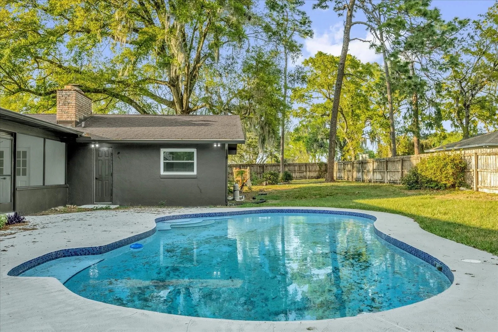 The back yard is private, fully fenced with a gorgeous open air pool and natural landcsape.