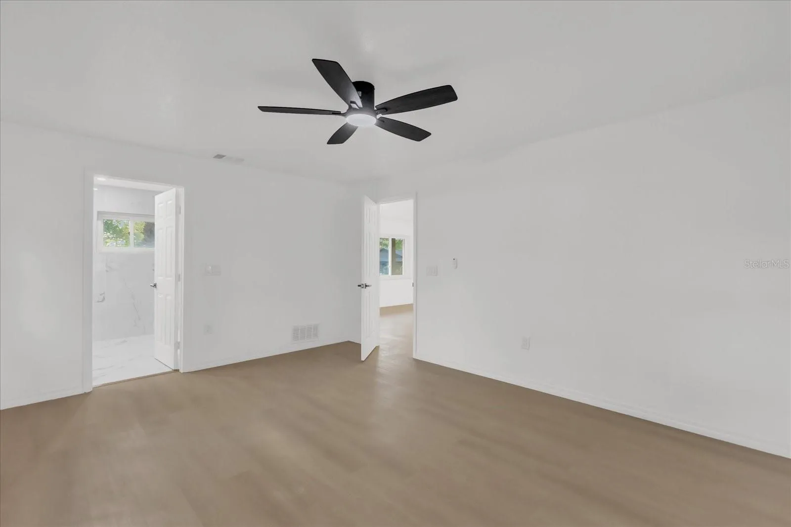 Primary Bedroom (approx 12x16) is very spacious and is on the opposite side of the home with great natural light, ensuite bath, walk in closet.