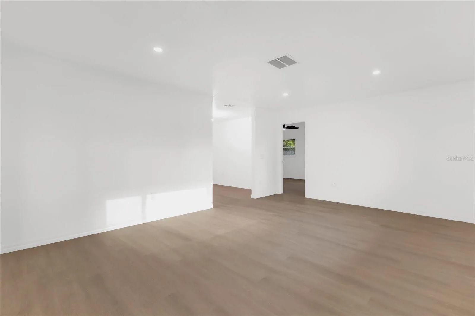 Living Room approx 19x13. Perfect for large gatherings and enetrtaining. Located near Dining, Kitchen and Family rooms for overflow. Great for large scale furniture or can be used easily as a game room.