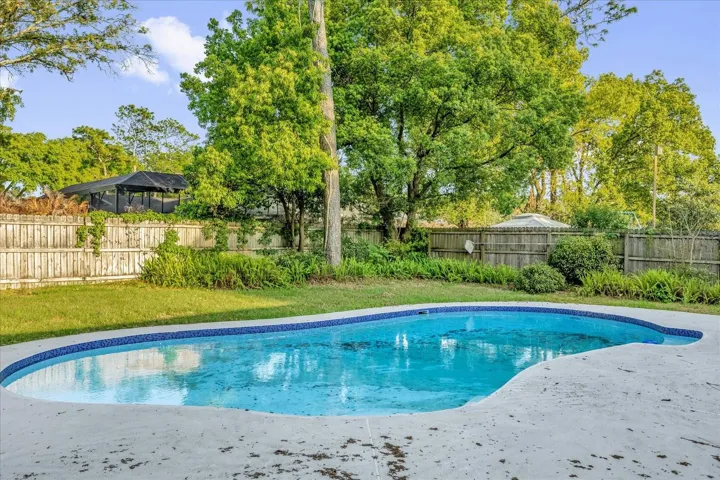 Private pool with freshly painted concrete deck.