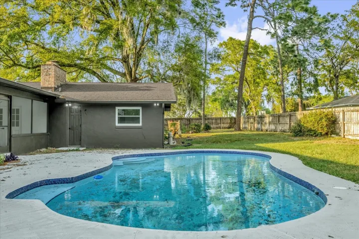 The back yard is private, fully fenced with a gorgeous open air pool and natural landcsape.