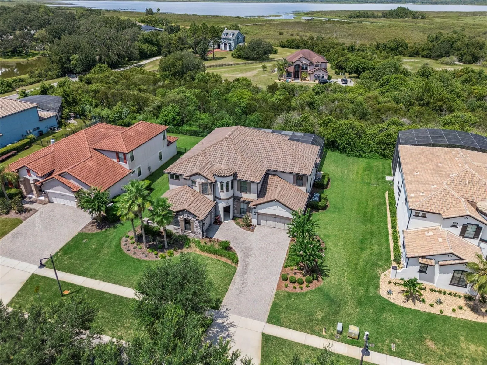 Luxury, privacy and LAKE ACCESS define this exceptional 6-bedroom, 5.5-bath CUSTOM POOL HOME in Waterside Vista, an intimate GATED ENCLAVE of just 24 residences in St. Cloud!