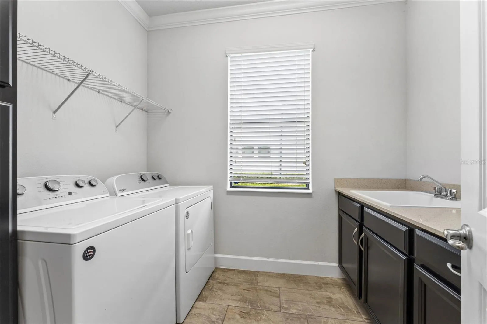 Laundry room complete with a laundry shoot from the second floor.