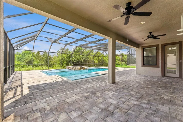 Covered lanai, screened pool.
