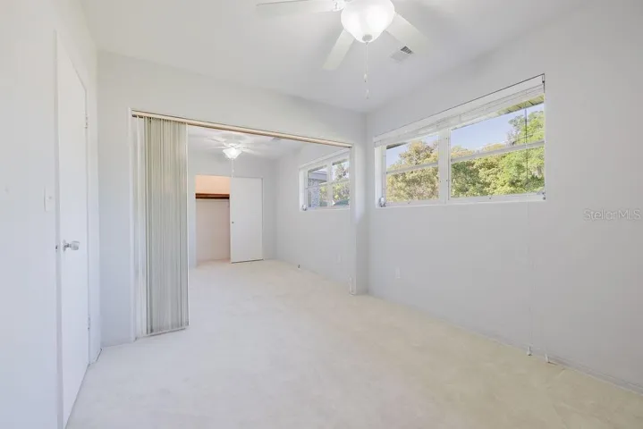 Bedroom 3 with built-in closet and light-and bright-window.