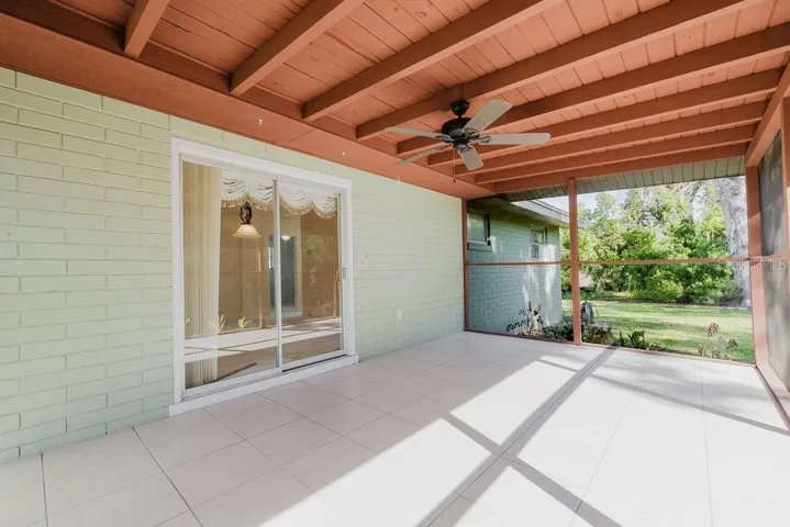 Beautiful back screened porch with sliding doors leading into the dining room. Great for extending indoor space to screened outdoor area.
