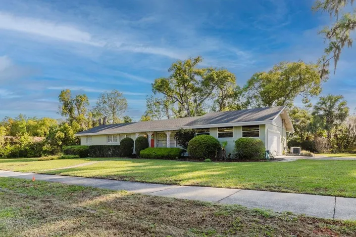 Corner view of home with side-facing garage
