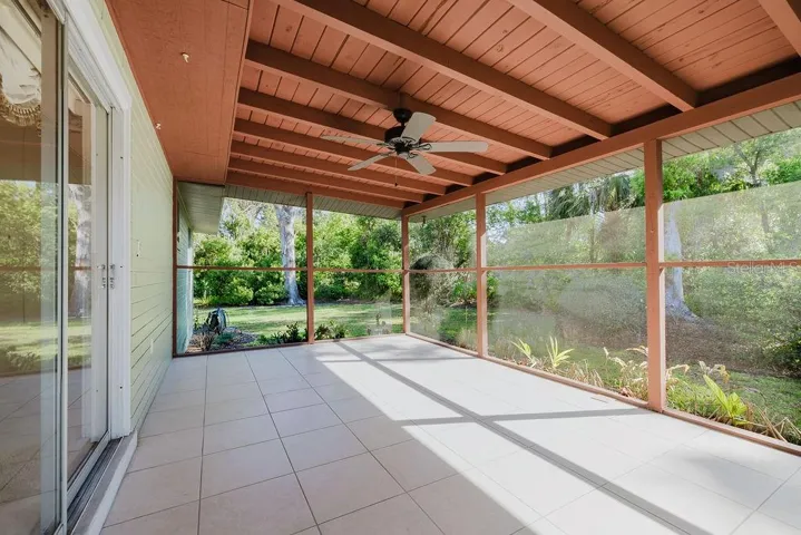Secluded back screen porch connecting to dining room and back yard.
